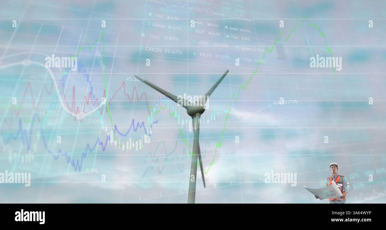 Engineer analyzing wind turbine data with charts overlaying sky background Stock Photo