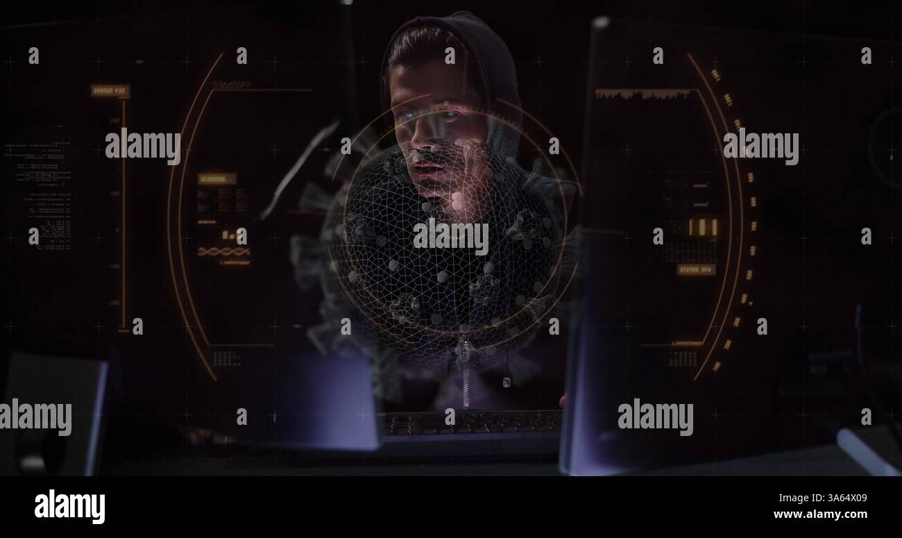 Hacker in hoodie analyzing data on multiple screens in dark room Stock Photo