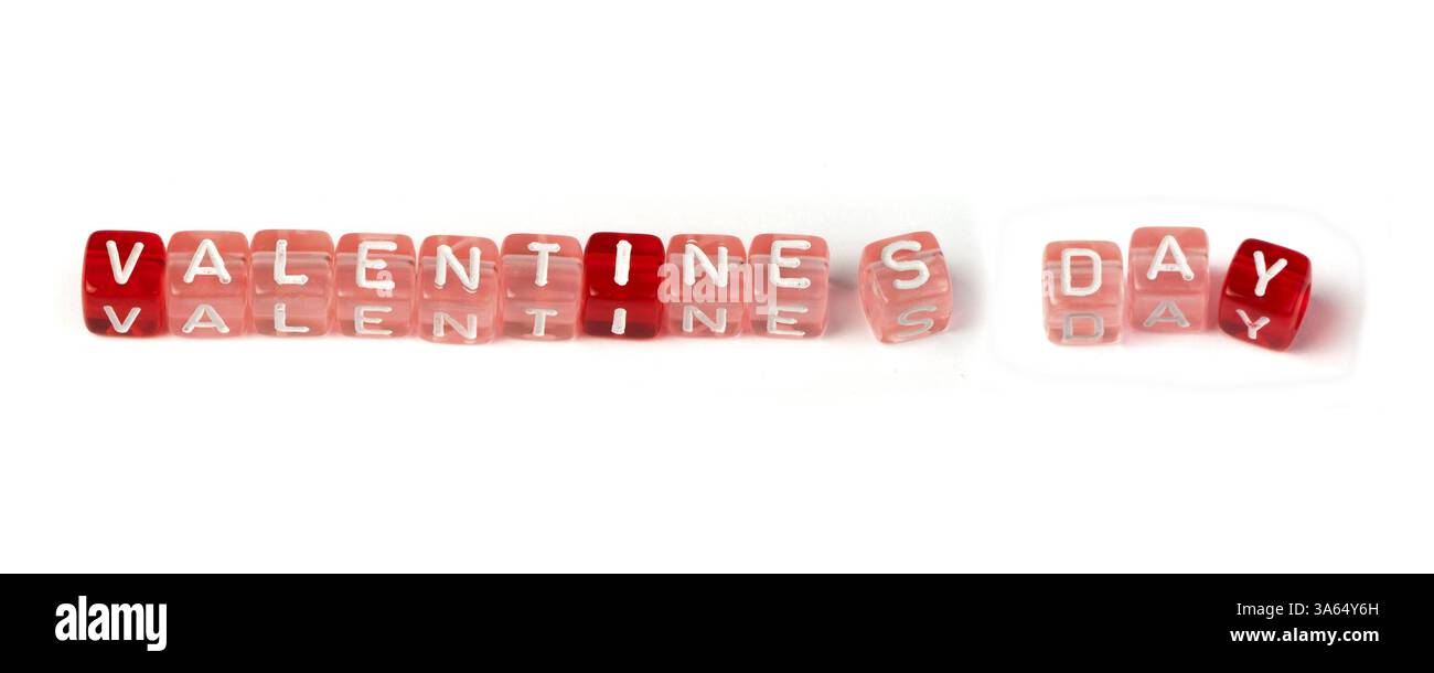 Words valentines day on multicolored cubes white isolated Stock Photo