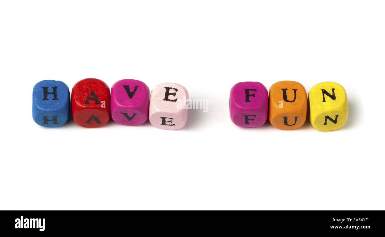Words have fun on multicolored wooden cubes white isolated Stock Photo
