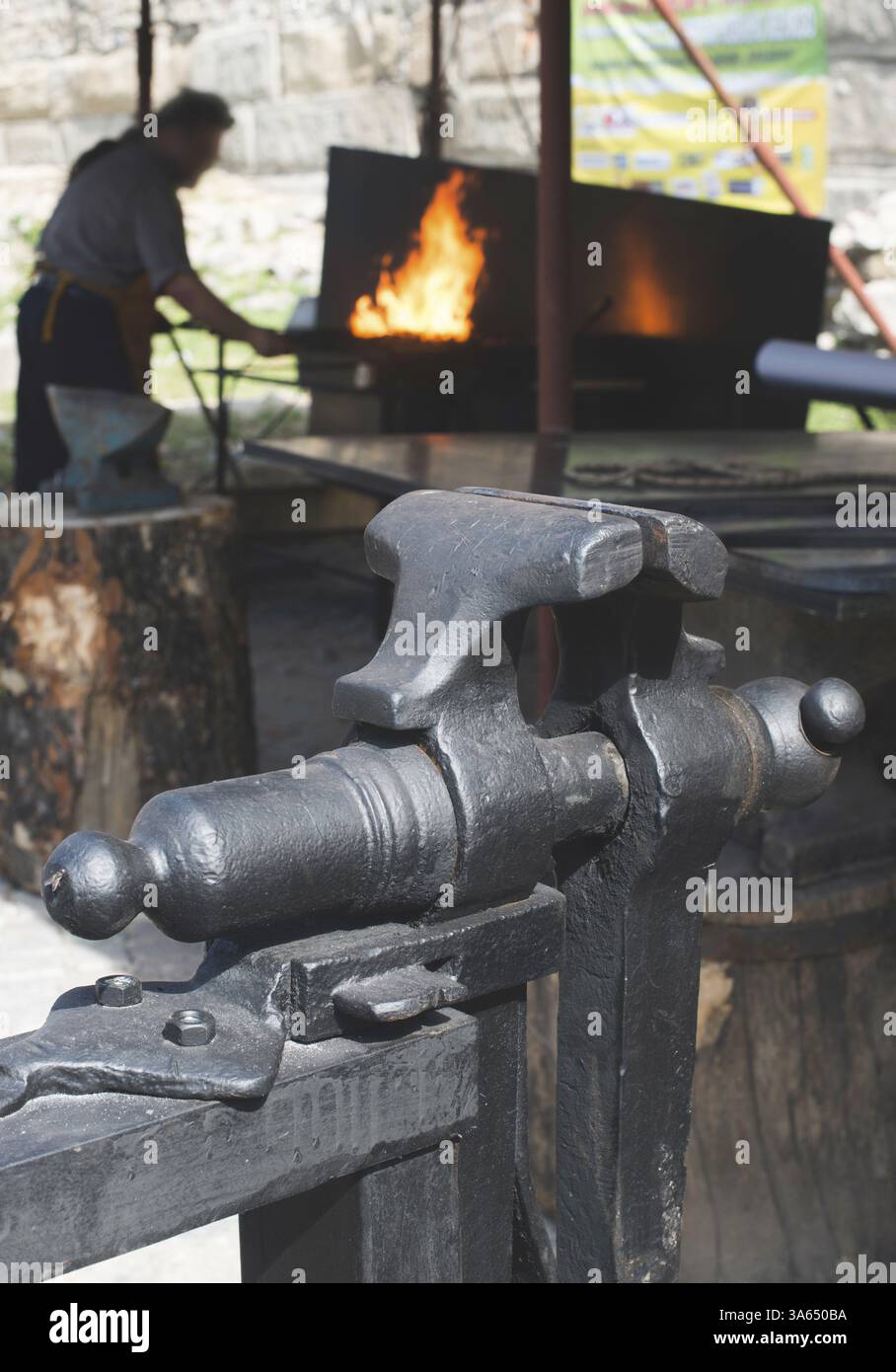 Vise and anvil in a forge shop. Blacksmith tools Stock Photo