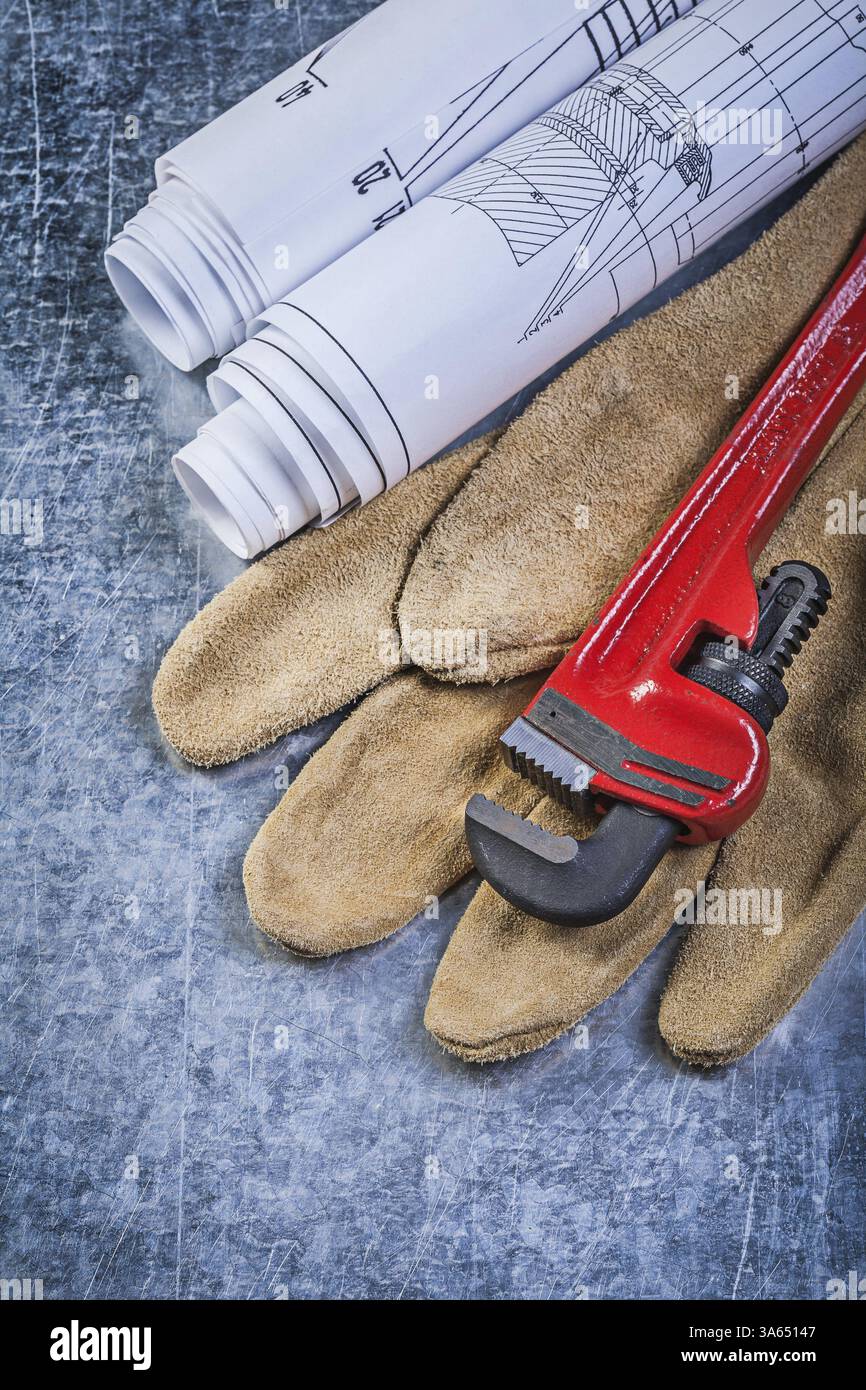 Pipe wrench construction plans leather protective gloves on metallic ...