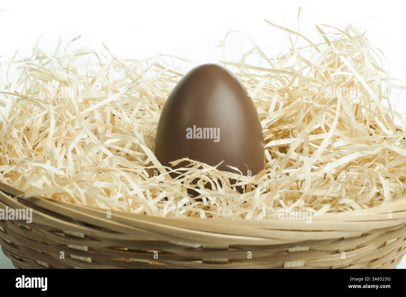 Chocolate Easter Egg in a bird's nest Stock Photo