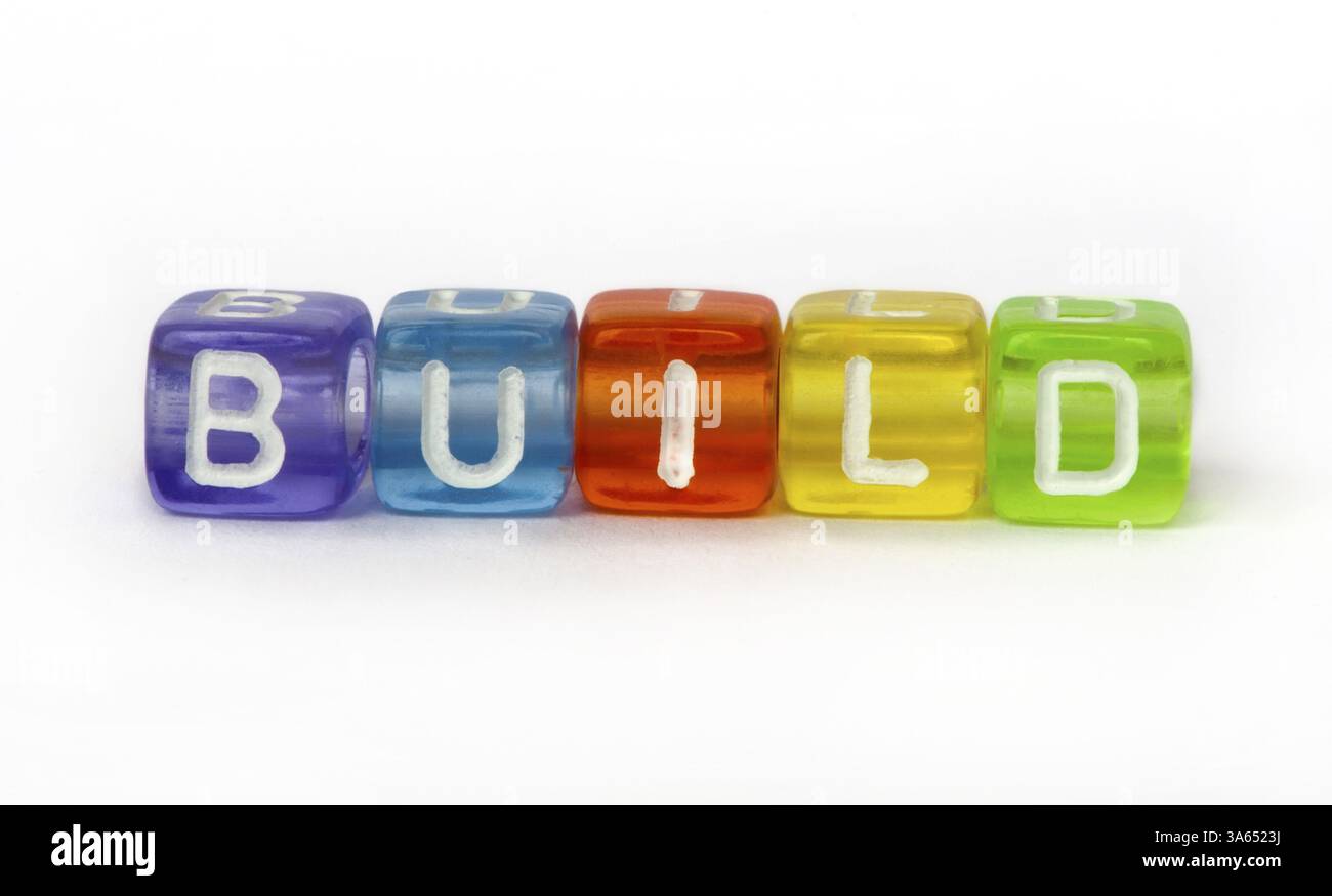 Text build on colorful wooden cubes over white Stock Photo