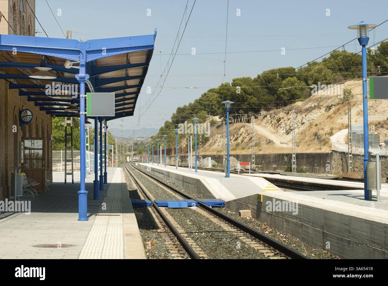 Ancient-style railway station and railroad rails Stock Photo - Alamy