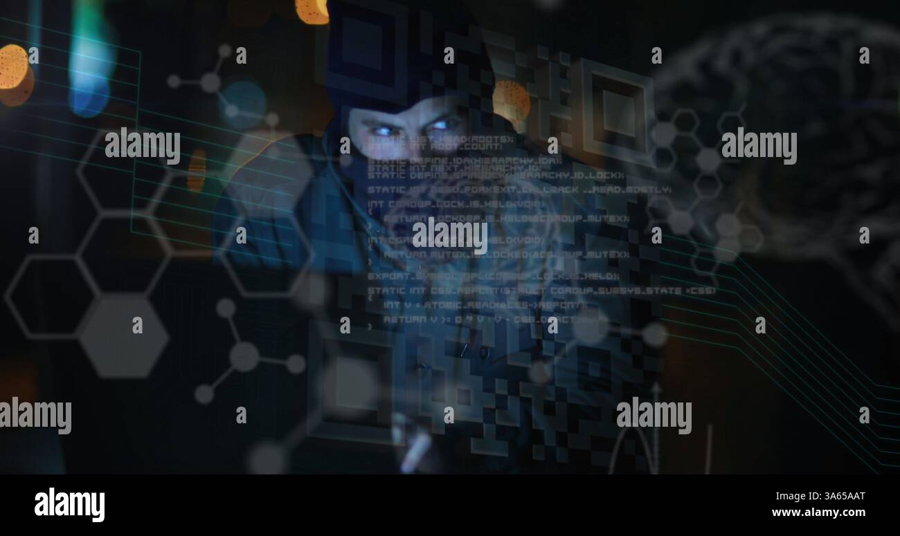 Image of data processing and glowing brain over hacker using computer Stock Photo