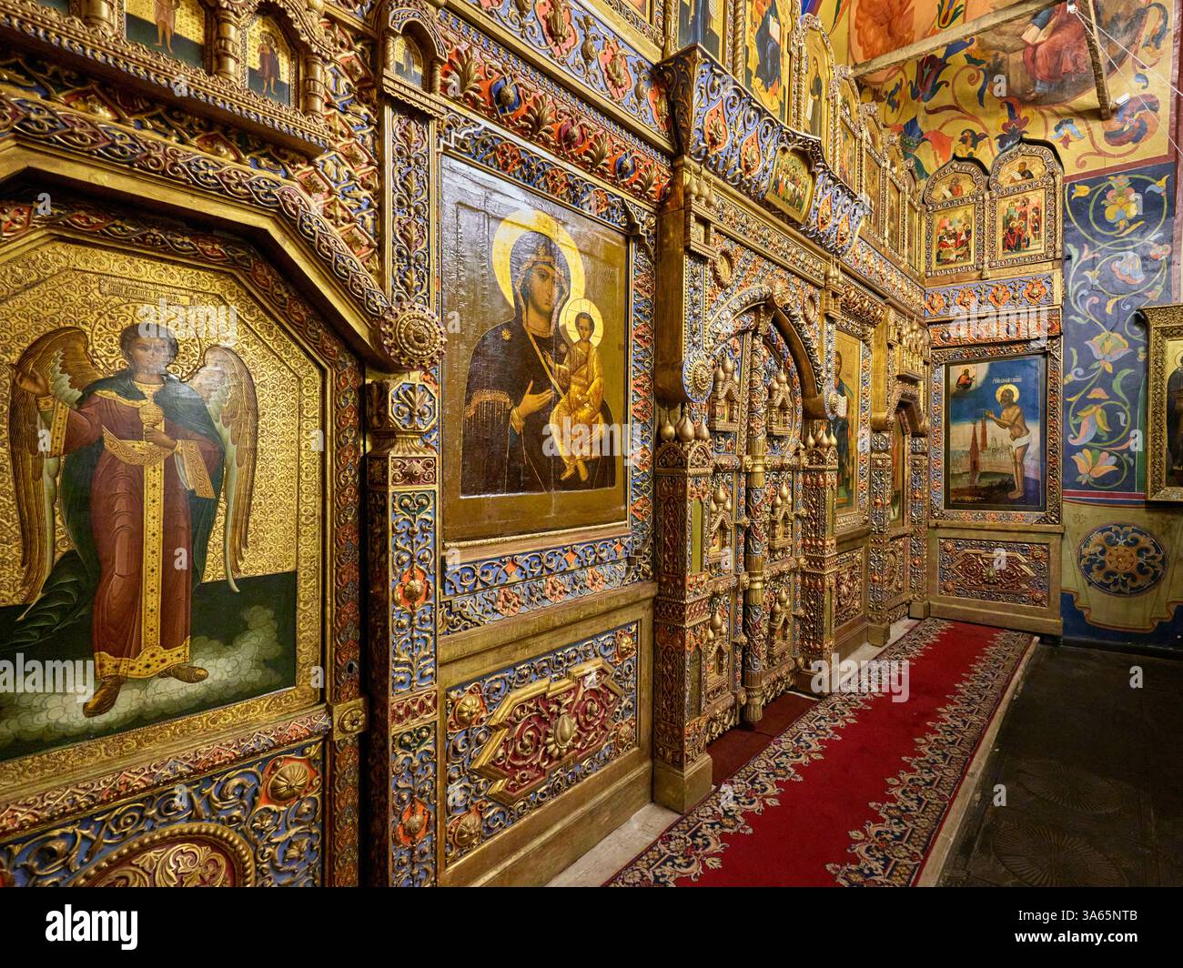 Oblique angle view of intricately decorated iconostasis in the 16th ...