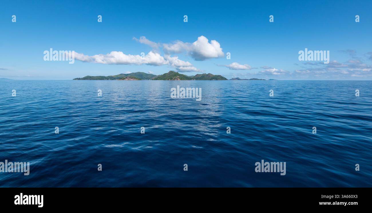 Blue Seascape with La Digue Island, Seychelles. Stock Photo