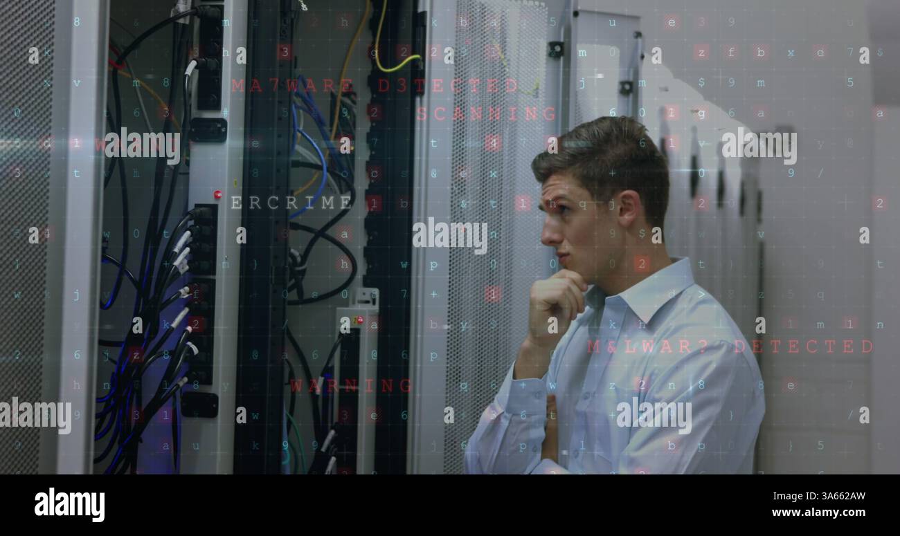 Analyzing server racks, IT professional focusing on cybersecurity issues in data center Stock Photo