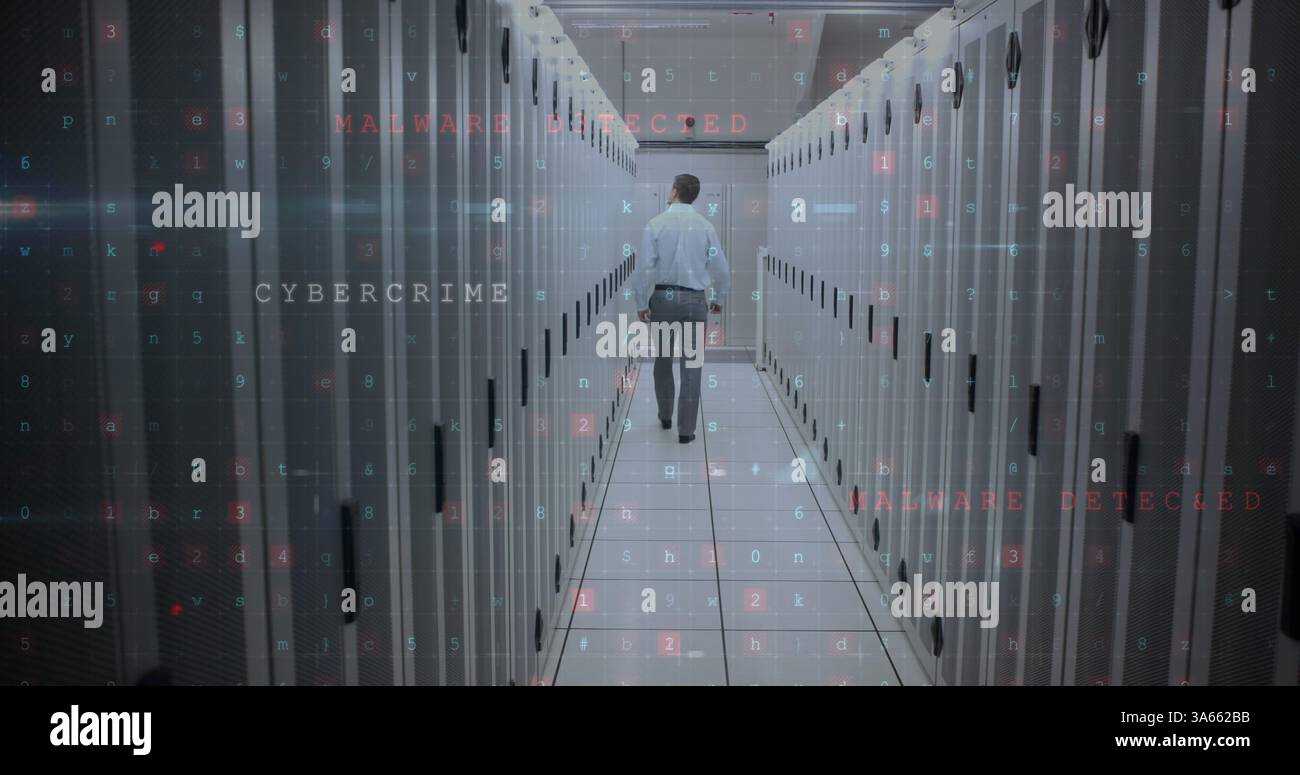 Walking through data center, technician addressing cybercrime and malware threats Stock Photo