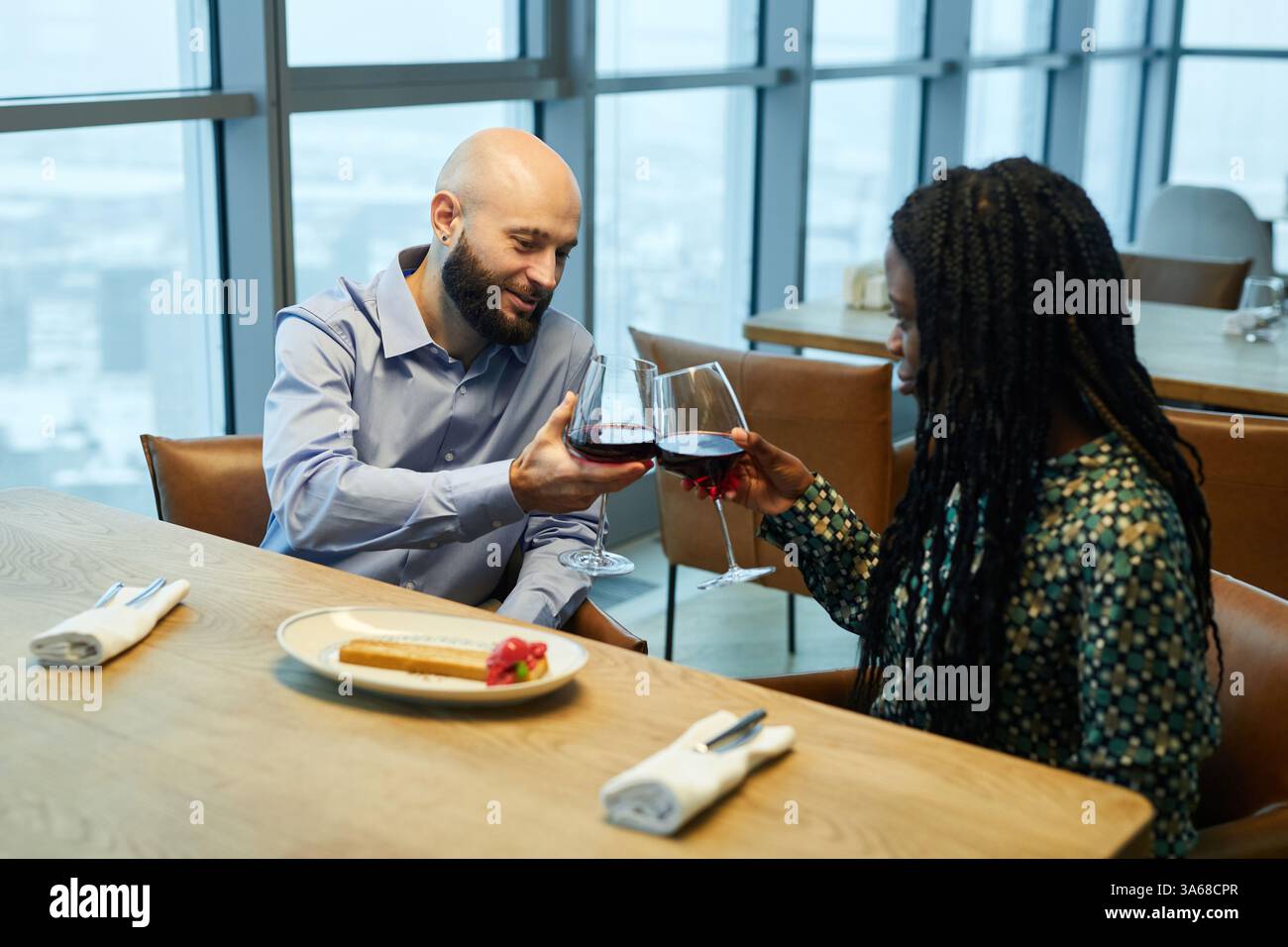 Couple Drinking Wine In Restaurant Stock Photo
