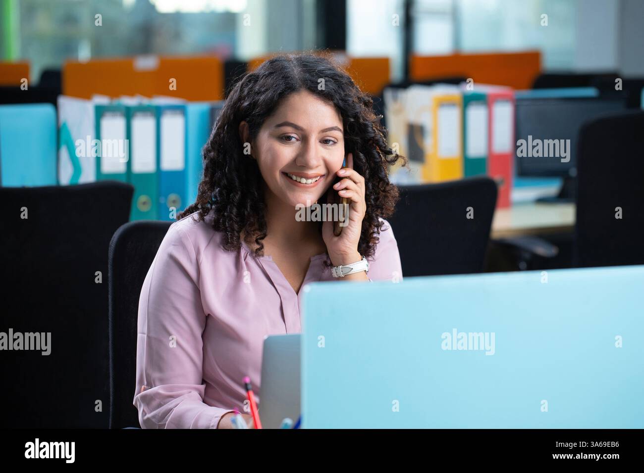 Corporate Lady In Office Is On Conference Call Stock Photo