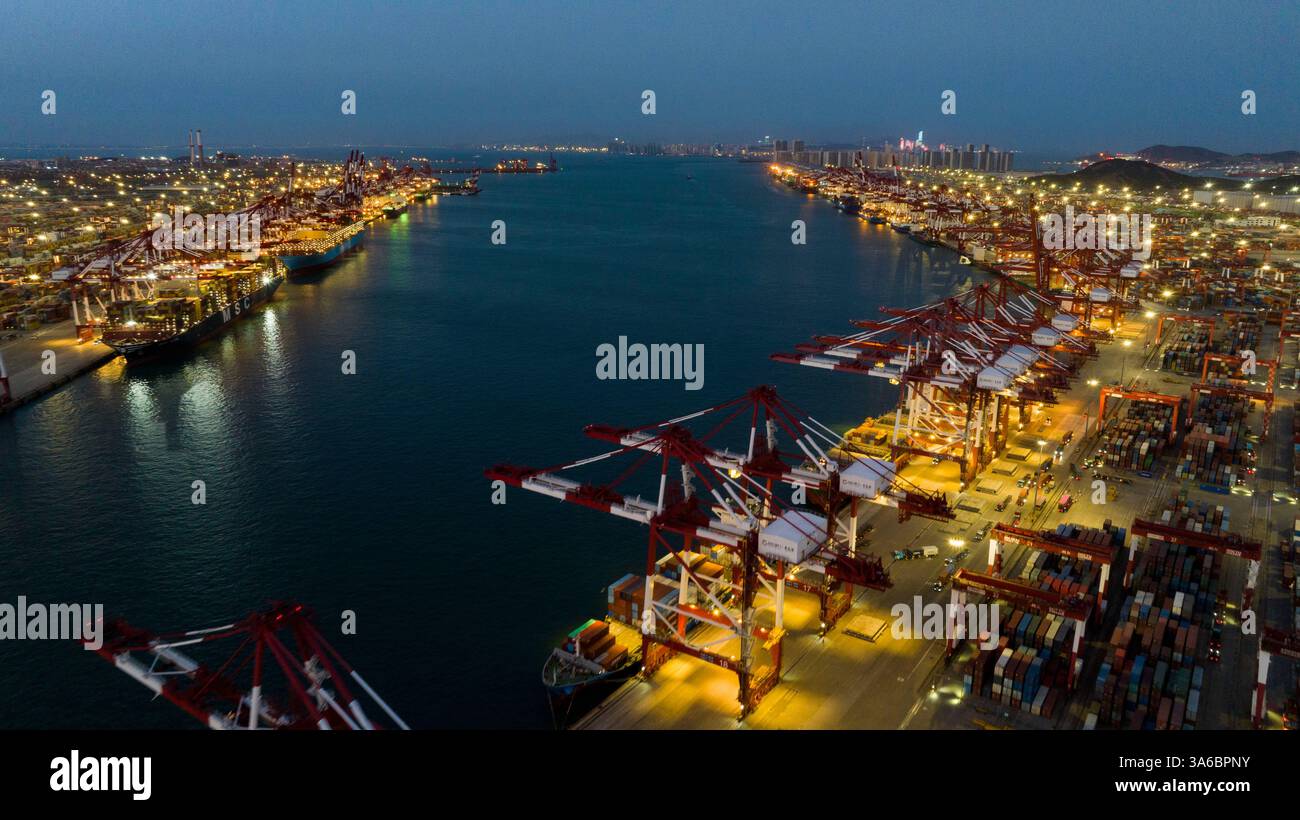 QINGDAO, CHINA - MARCH 25, 2025 - Container ships docked at berth to ...