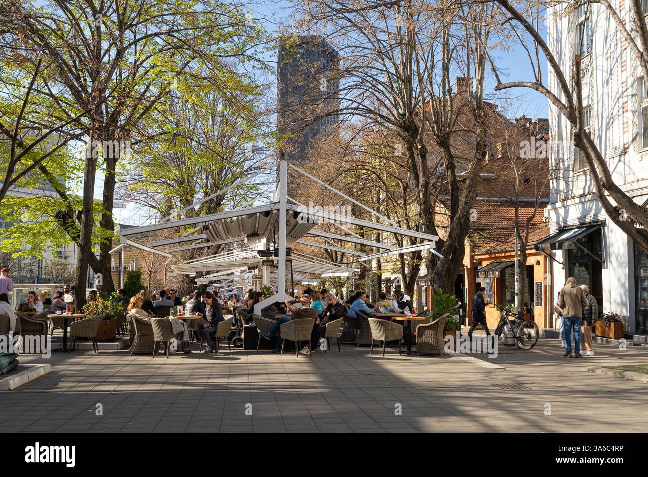 Belgrade, Serbia. March 21 2025.  people sitting in outdoor bars in a street in the city center Stock Photo