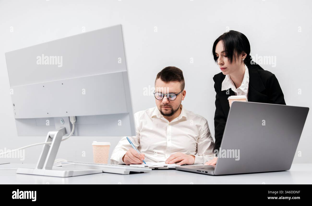 Specialists in the office discuss and solve the problem of declining sales and revenues. The concept is to show teamwork, analysis Stock Photo