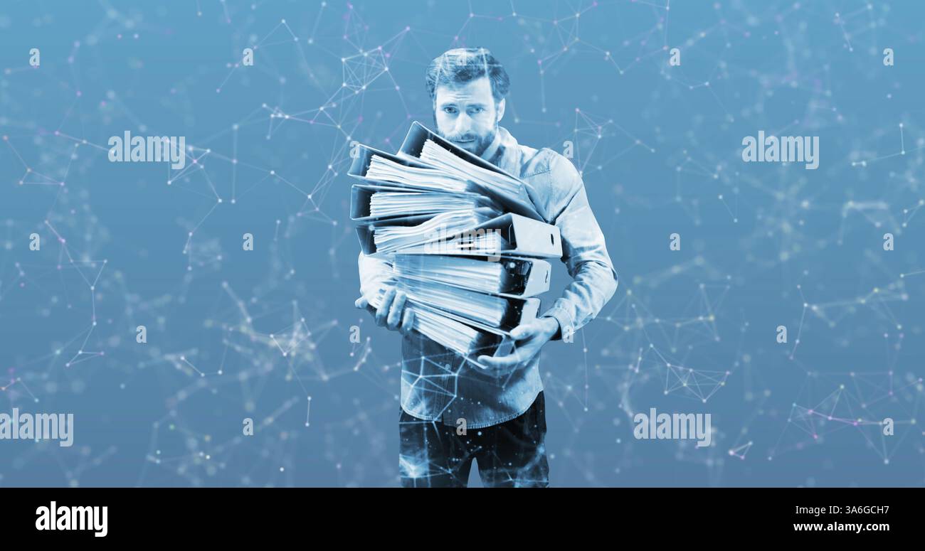 Carrying large stack of binders, businessman overwhelmed with paperwork and deadlines. Office, stress, multitasking, workload, pressure, corporate Stock Photo