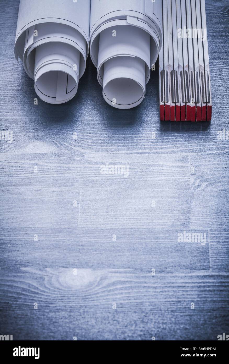 Copyspace image two rolled up white blueprints and wooden meter Stock ...