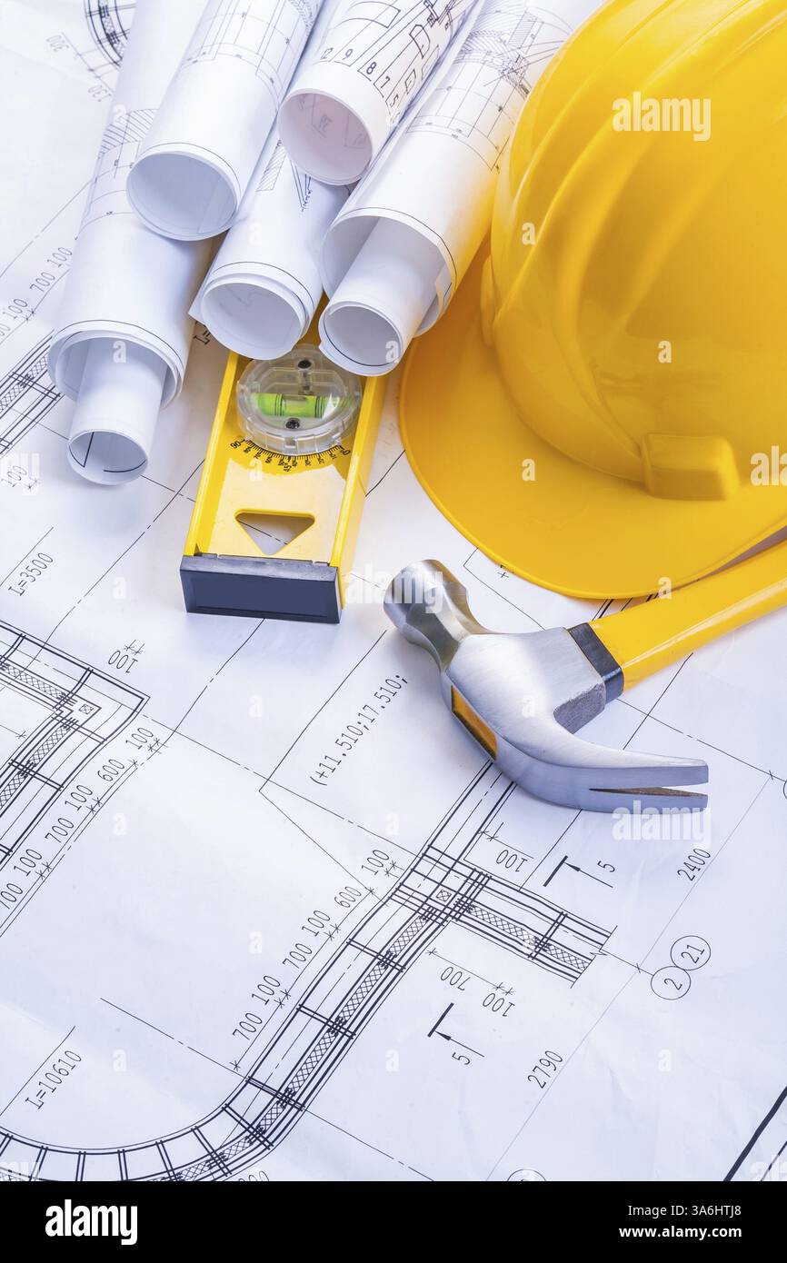 Claw hammer construction level helmet rolled blueprints Stock Photo - Alamy