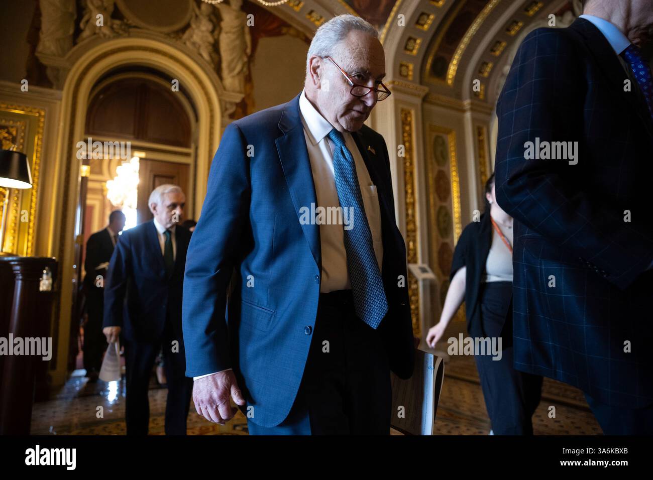 Senate Minority Leader Chuck Schumer (D-N.Y.) emerges from a Senate ...