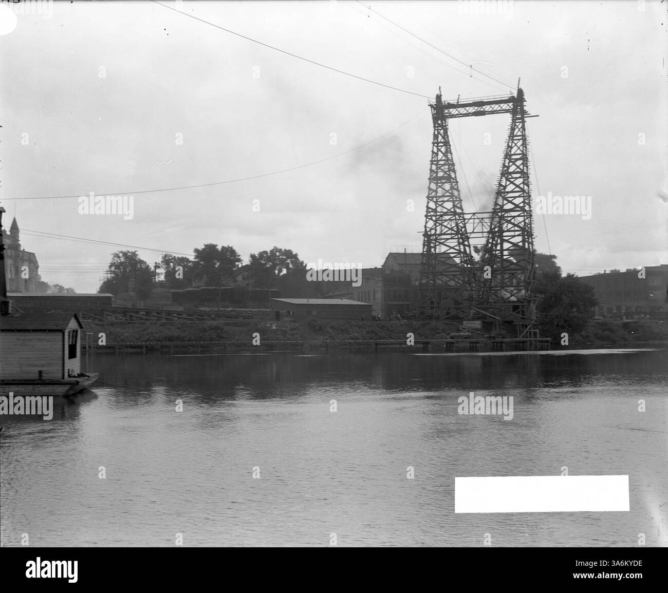The Third Avenue Bridge construction is depicted from the East bank of ...