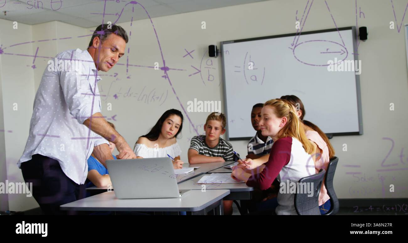 Teacher explaining math concepts to attentive students in classroom, using laptop. Education, teaching, technology, learning, engagement, instructing Stock Photo