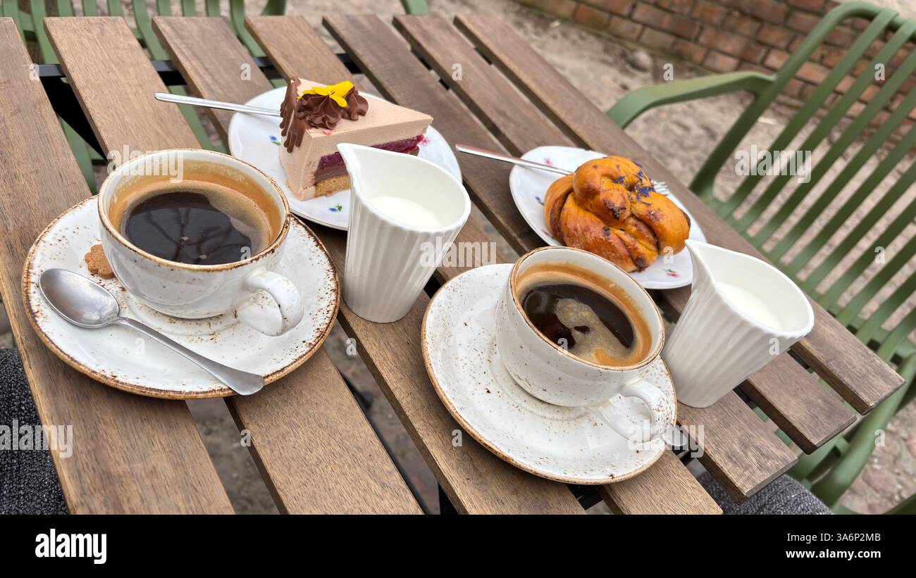 Beautiful delicious coffee and cake outdoors at a street cafe - Smartphone Captured Stock Image