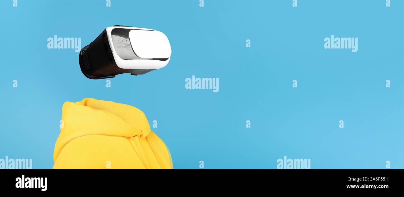 User interacts with modern VR headset in creative technology collage Stock Photo