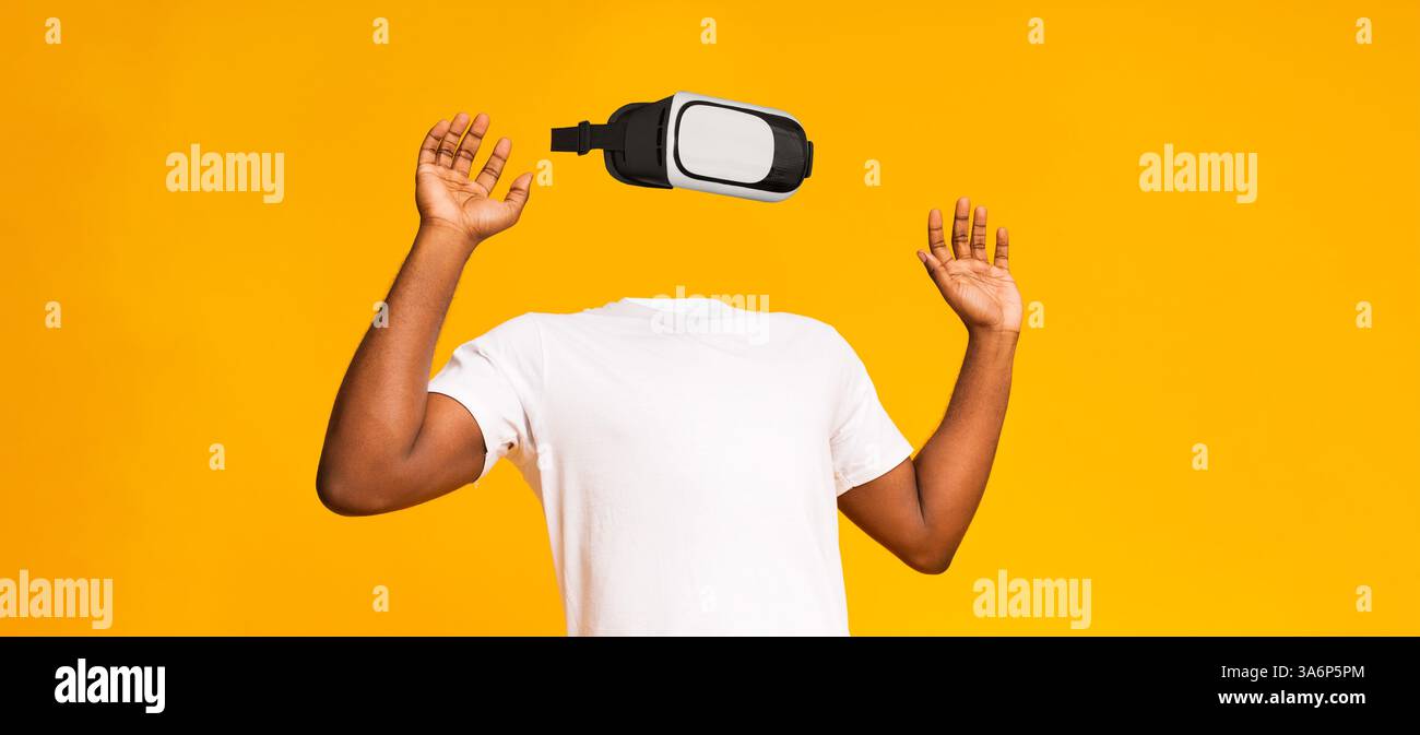 User interacts with virtual reality technology in a vibrant setting Stock Photo