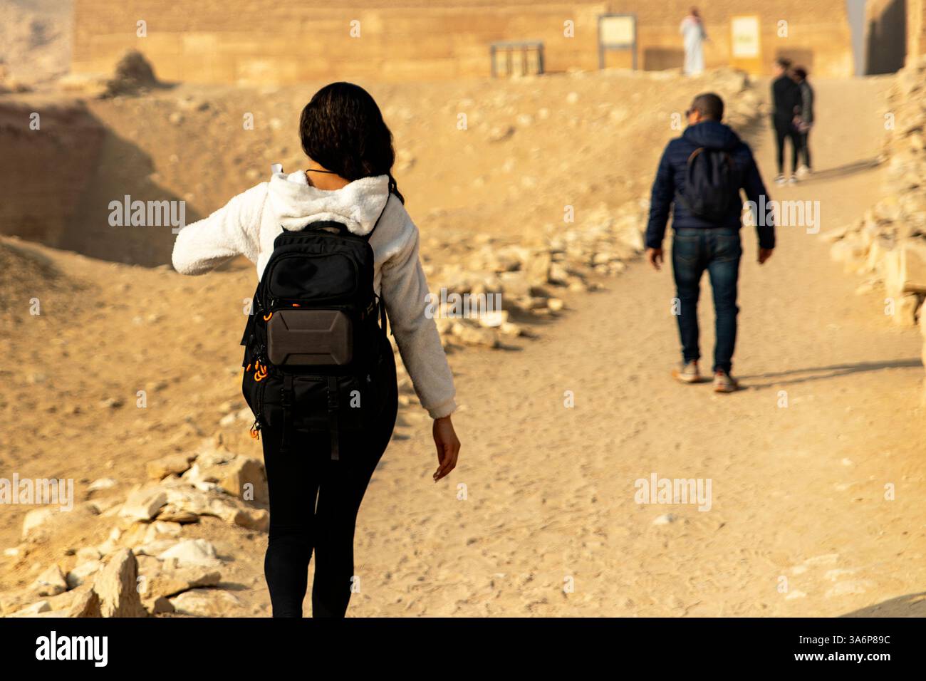 Witness a tourist exploring Egypt's enigmatic ruins, venturing into ...
