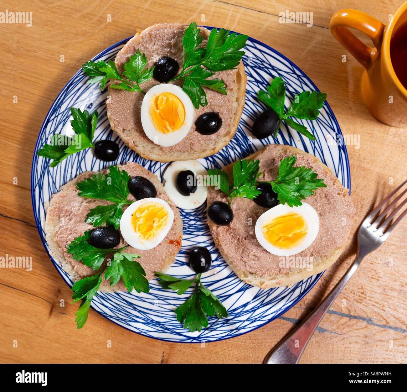 Pollock Roe Bread Sandwiches with pollock liver and roe pate, eggs, olives and greens ...