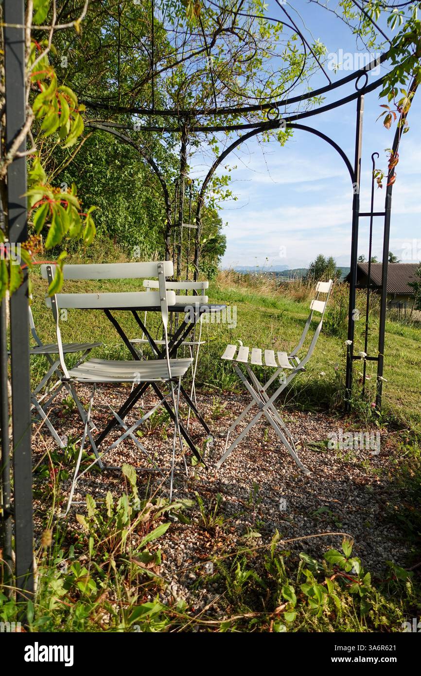 Scenic Outdoor Seating Under Pergola Stock Photo