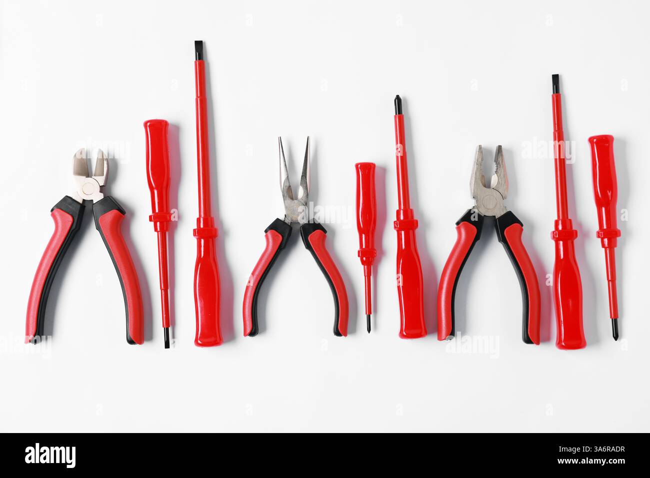 Different electrical tools on light background, flat lay Stock Photo