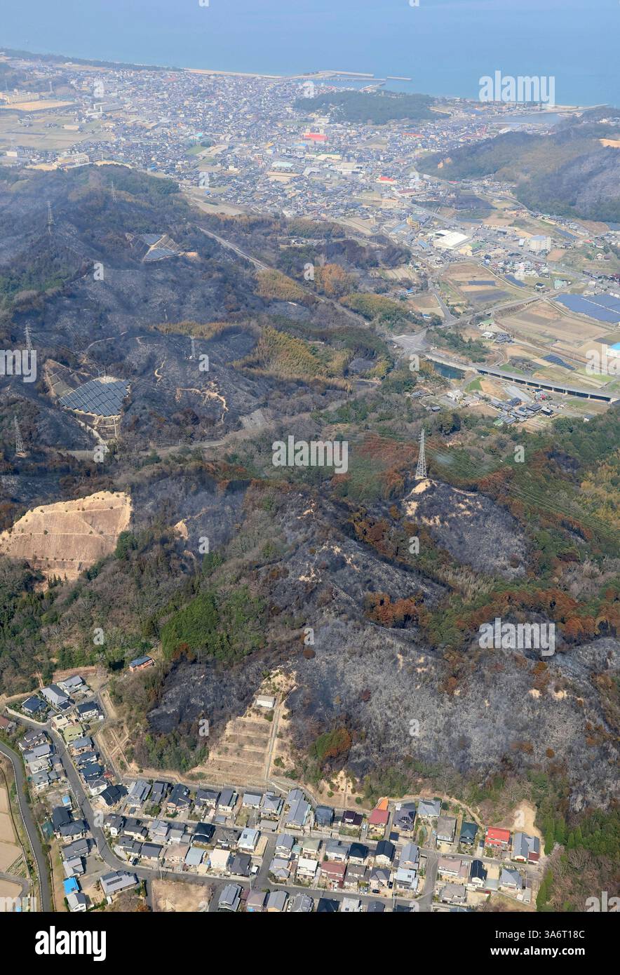 Aerial photo shows burnt mountain forest due to forest fire in Imabari ...