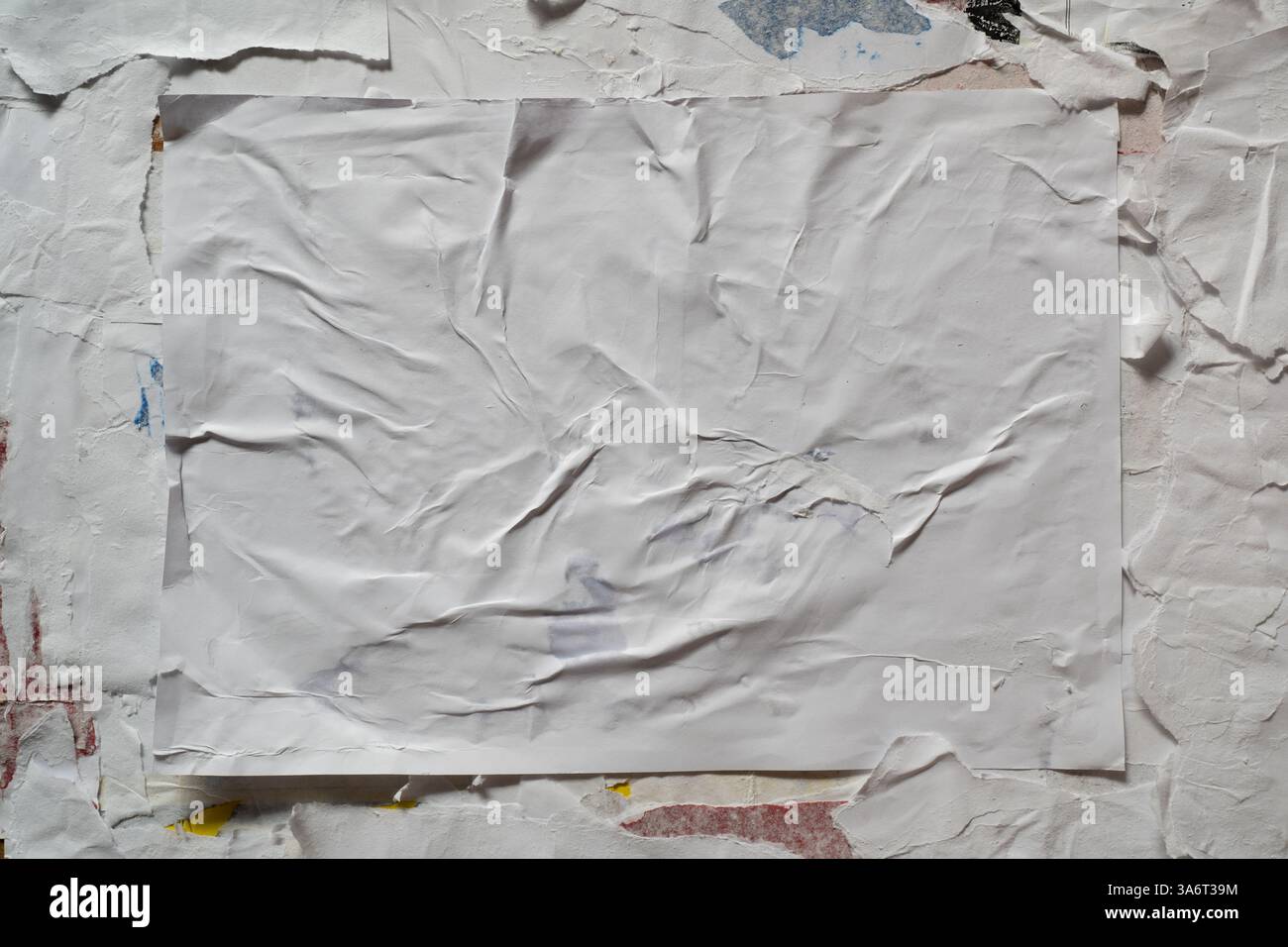Wheatpaste poster style texture on a dirty wall Stock Photo