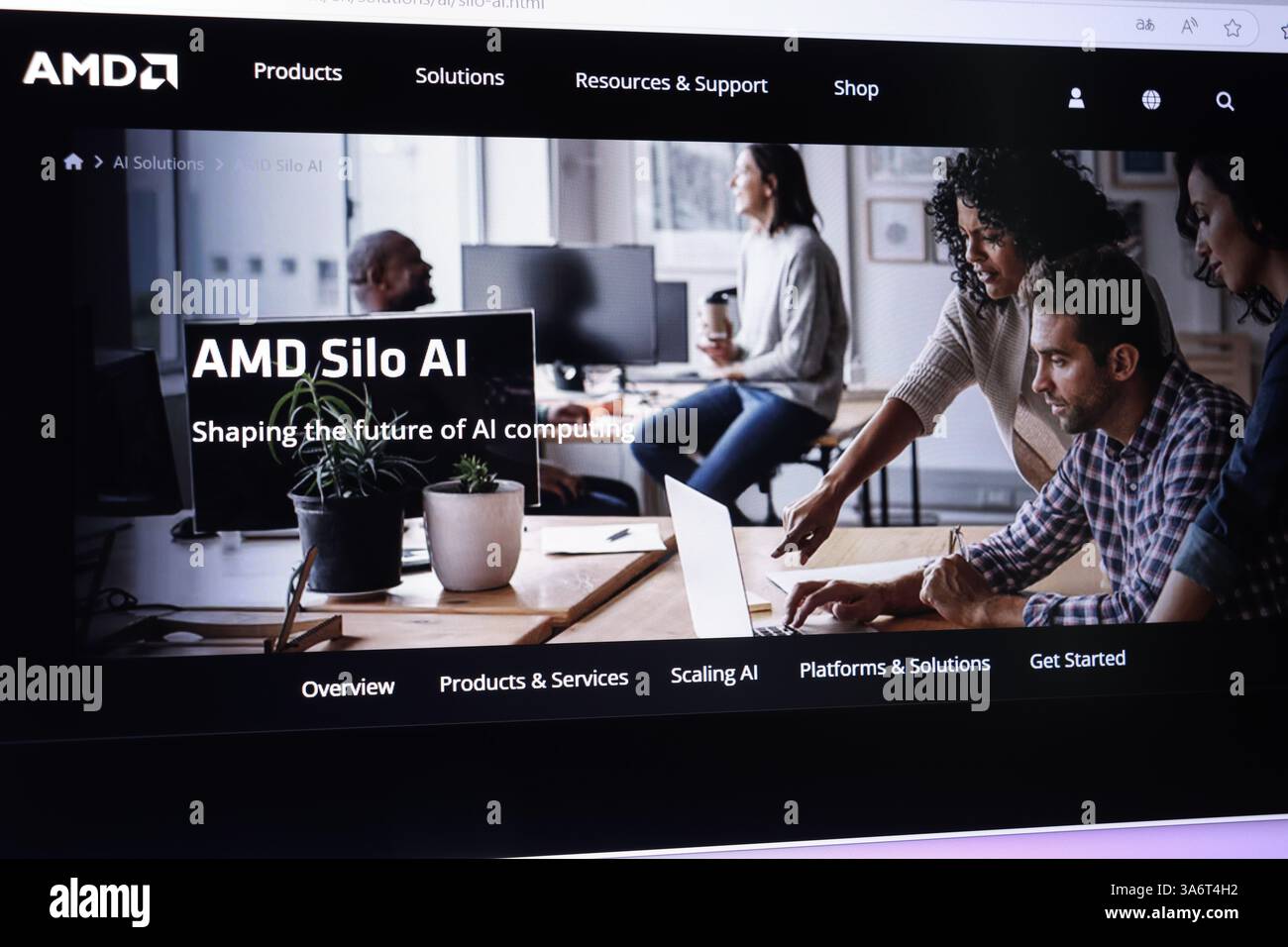 Diverse team collaborating on ai solutions in modern office. Stock Photo