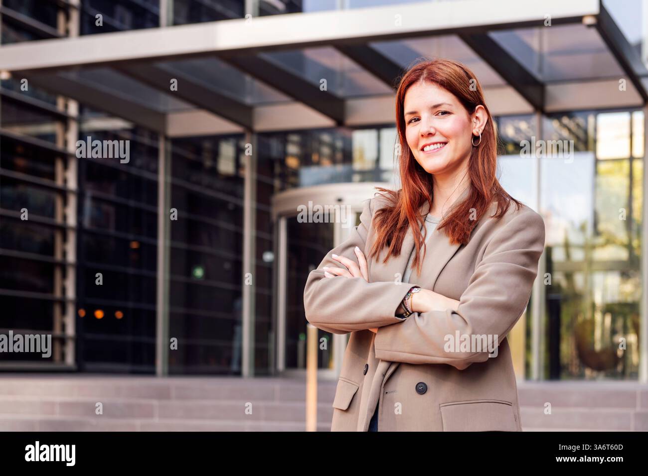 Professional woman standing arms hi-res stock photography and images ...
