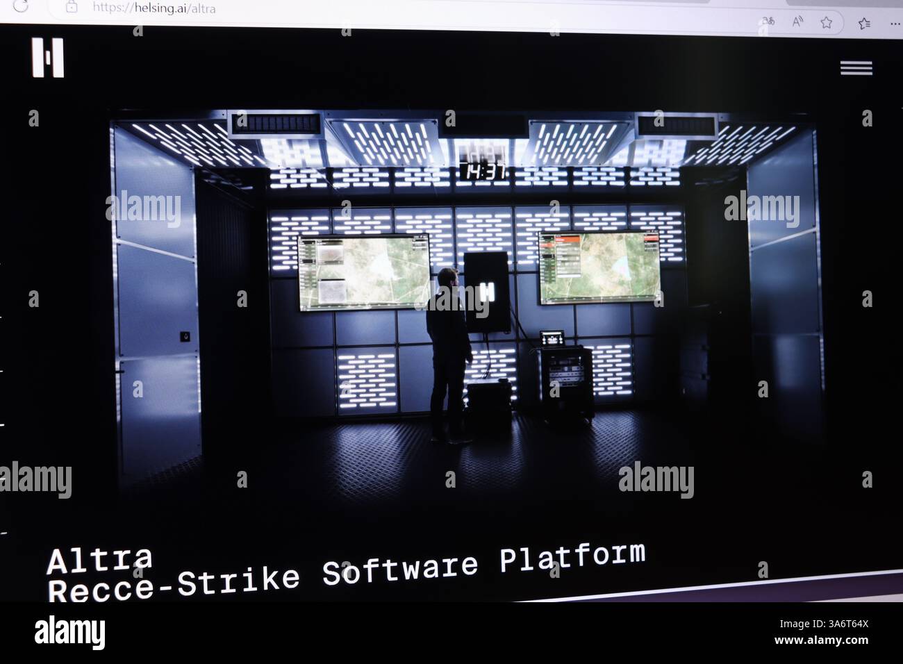 Man in high-tech control room analyzing military software on multiple screens. Stock Photo