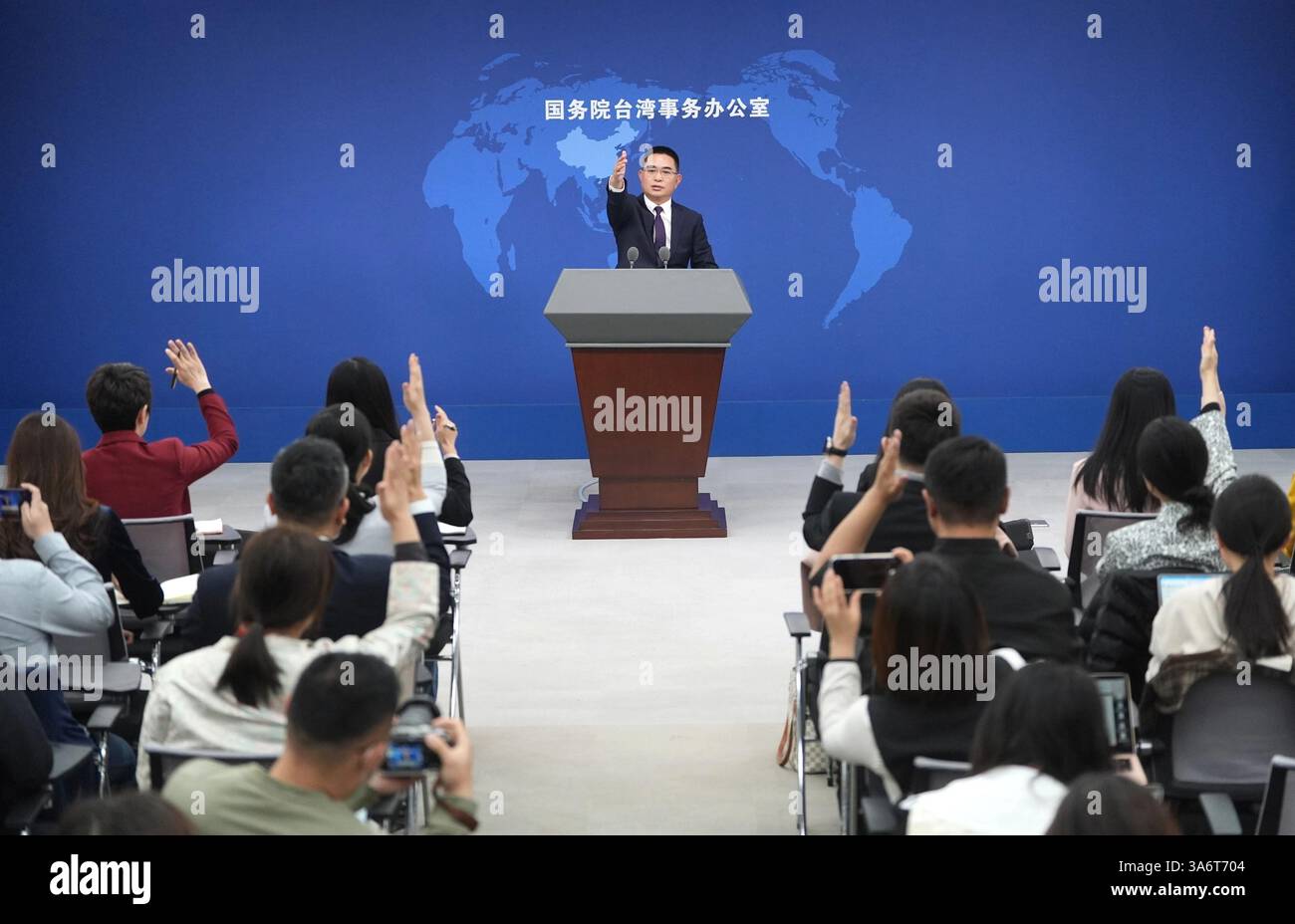 Beijing, China. 26th Mar, 2025. Chen Binhua, spokesperson for the Taiwan Affairs Office of the State Council, gestures at a regular press conference in Beijing, capital of China, March 26, 2025. Credit: Chen Yehua/Xinhua/Alamy Live News Stock Photo