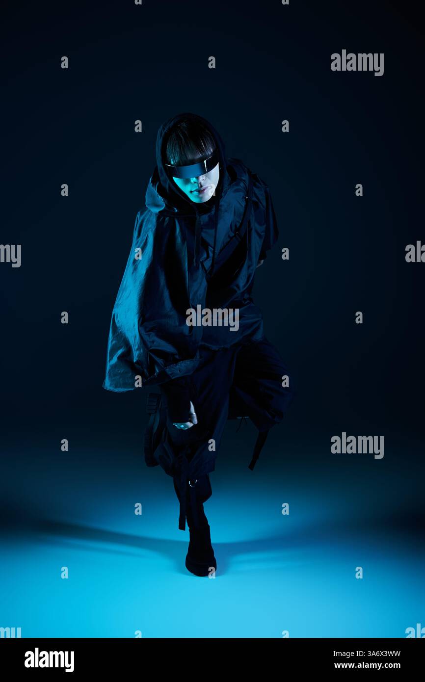 A stylish young man exudes confidence against a striking blue backdrop ...
