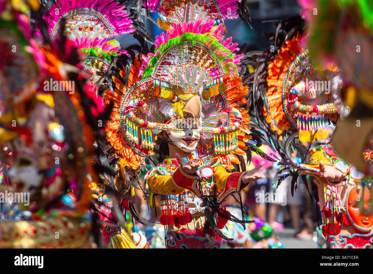 Masks Joined Colorful and elaborately costumed Masskara Festival dancers wearing ...
