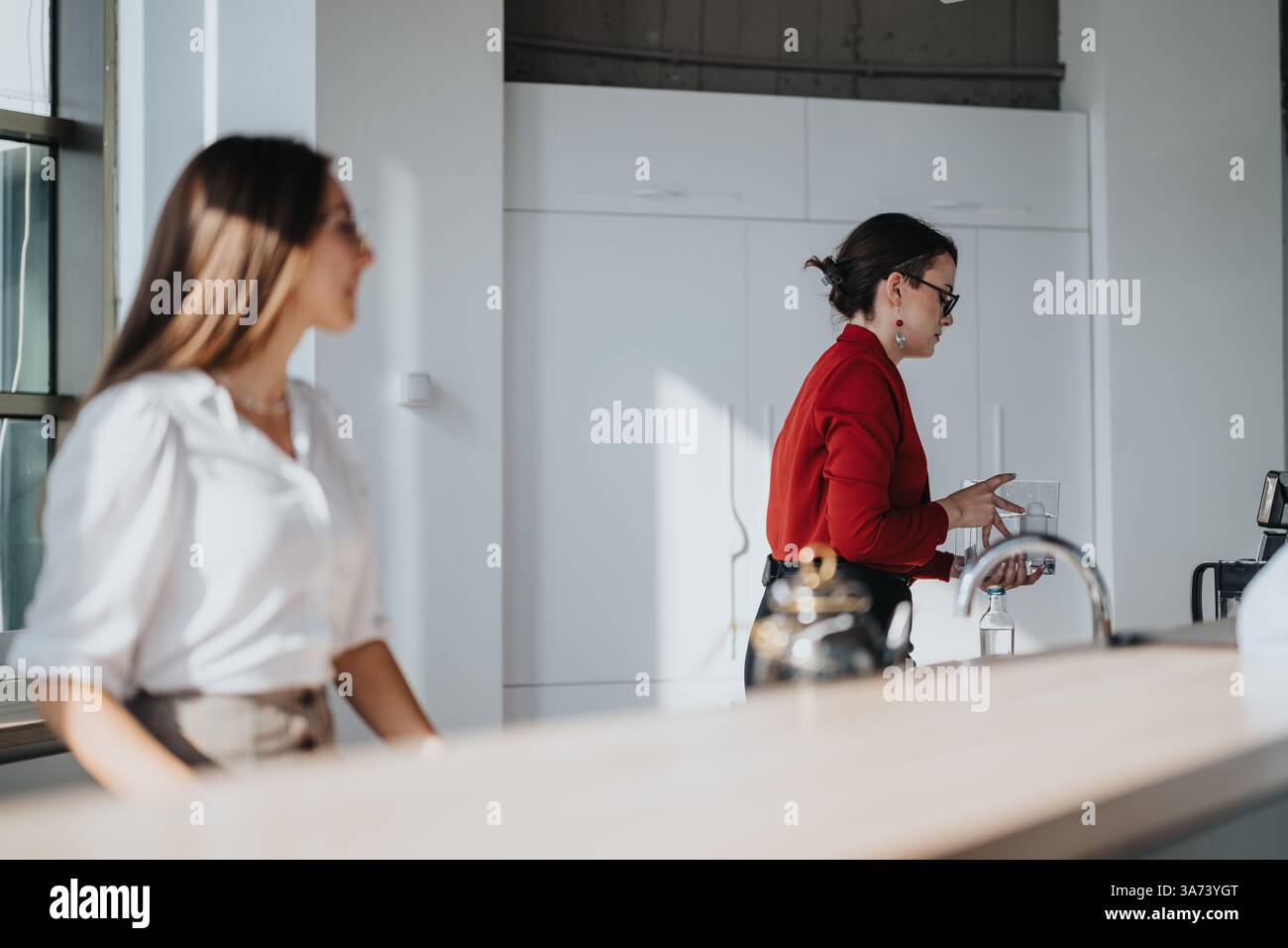 Multicultural business workers enjoying a break in modern office Stock Photo