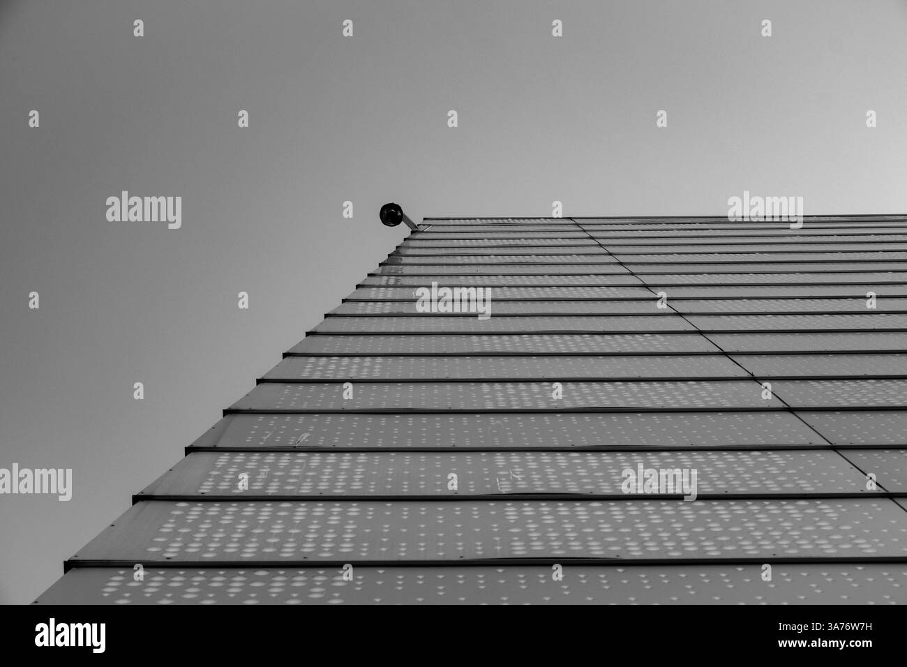 Black and white geometrical shot of the Oslo opera house exterior against a clear summer sky Stock Photo