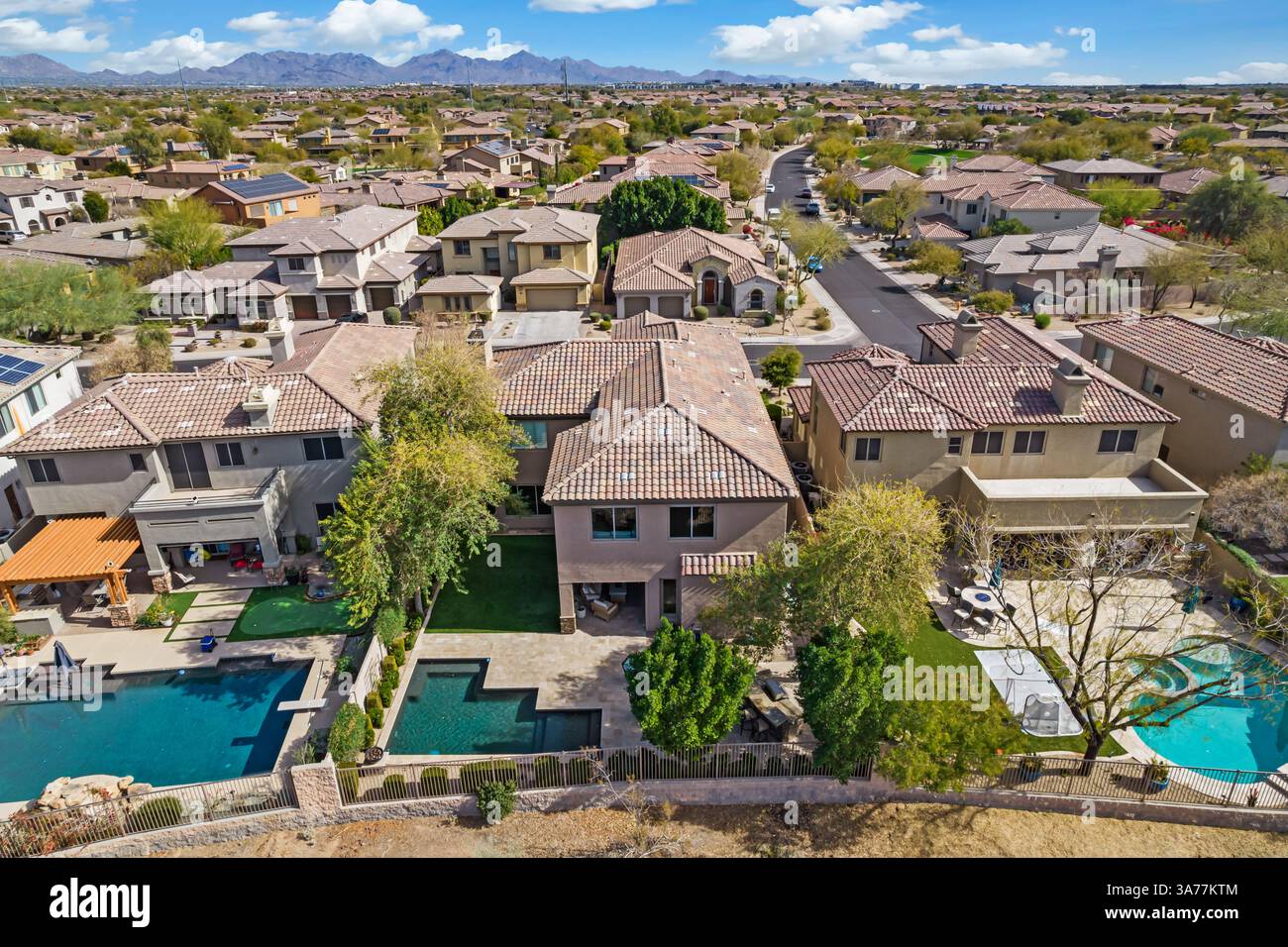 Aerial view of a residential area with many houses and a pool Stock ...