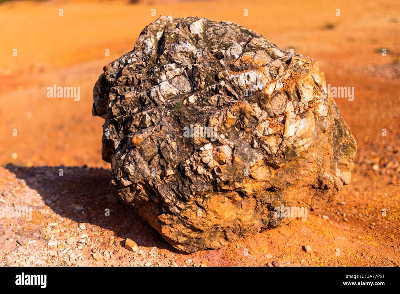 Boxcite Eroded bauxite rock formation with bright orange colors in an abandoned ...