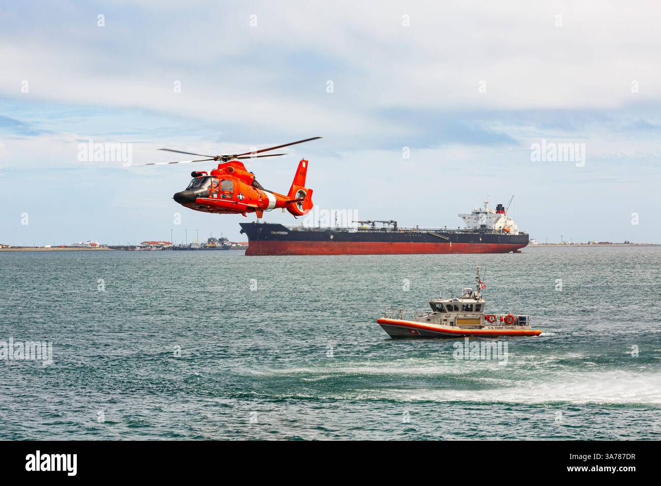 US Coast Guard helicopter hovering over the water in a demo of a rescue ...