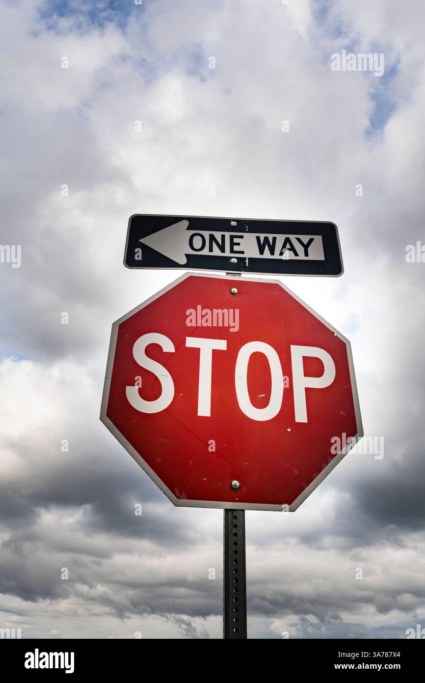 Red stop sign with One Way sign attached Stock Photo - Alamy
