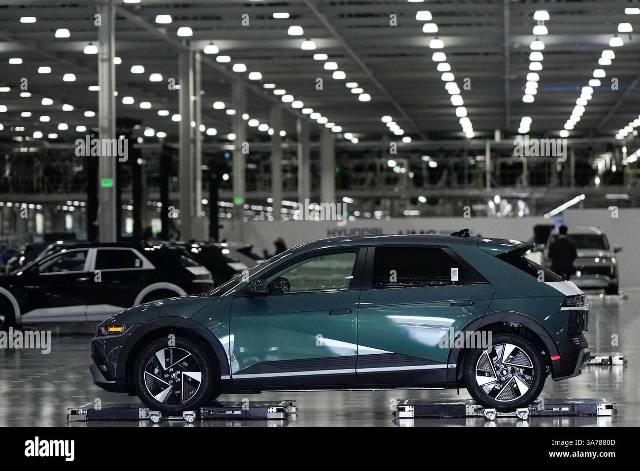 Vehicles move on the line at the Hyundai Motor Group Metaplant America ...