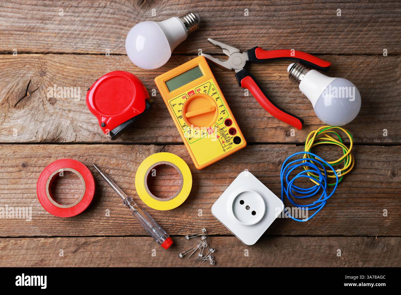 Different electrical tools on wooden table, flat lay Stock Photo
