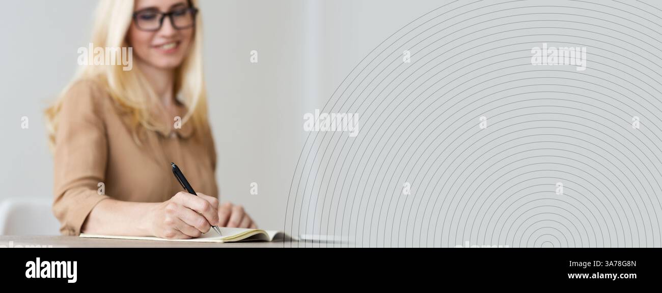 Mature Freelancer Writing Down Plans Project Into Notebook Stock Photo
