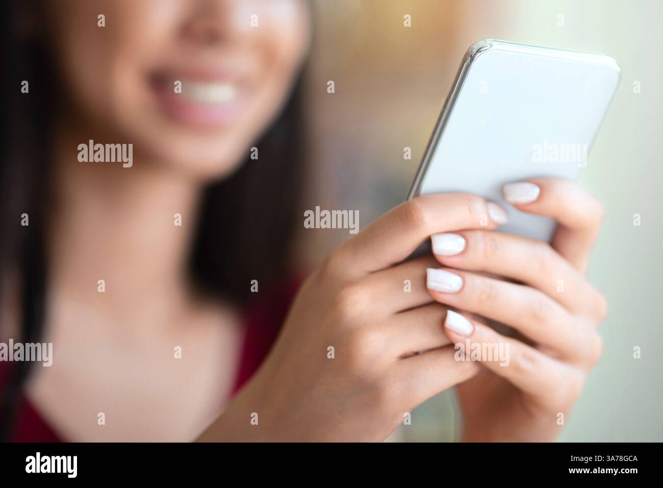 Closeup Image Of Unrecognizable Woman Using Modern Smartphone, Texting Or Browsing Internet Stock Photo